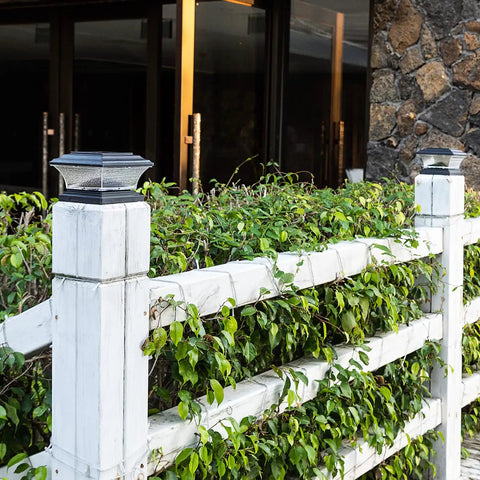 Solar Post Cap Lights For Outdoor Deck And Fence LED Post Caps With 9 Lighting Modes Including Bright White And RGB Color Options Fixed And Cycling Colors Fits 4x4 Or 5x5 Wooden Posts Black 6 Pack on wooden fence