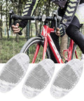Cyclist riding with 8 Pack Bike Front And Rear Reflectors Kit For Bicycle Wheel Spoke Reflectors Set In Red And White Color