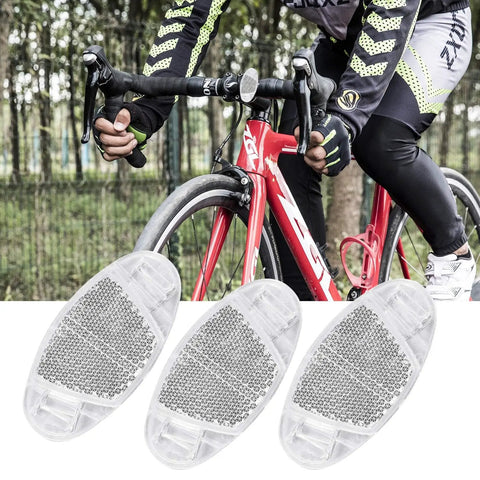 Cyclist riding with 8 Pack Bike Front And Rear Reflectors Kit For Bicycle Wheel Spoke Reflectors Set In Red And White Color