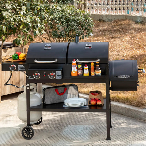 Two Burner Gas And Charcoal Grill Combo With Offset Smoker And Side Burner For Backyard BBQs, black grill in outdoor setting