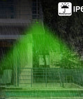Heavy Hitter Solar Game Feeder Lights With Vibrant Green Motion Detection illuminating an area in rain, showcasing waterproof IP66 design.