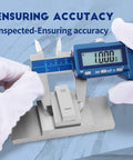 Six Inch Absolute Origin Digital Caliper in Stainless Steel, IP67 Water and Dust Resistant, measuring a metal block