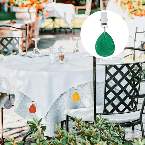 Outdoor table with 12 Pack Marble Tablecloth Weights With Teardrop Metal Clips, Green Stone Table Cover Pendants hanging on tablecloth