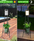 Side by side view of Dope Solar Outdoor Floor Lamp With Plant Stand 2 Pack Waterproof Metal Garden Lights on deck.