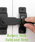 Close-up of Matte Black Stainless Steel Barn Door Latch 4.33 By 3.23 Inch being installed on door, showing rotary lock mechanism.