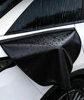 Beat The Elements EV Charger Cover For Chevy Blazer Ev shielding charger port with water droplets on a black cover.