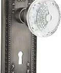 Crystal Meadows Plate Keyhole Knob Passage Set With Two And Three Eighths Inch Backset In Antique Pewter Finish featuring a detailed knob and backplate.