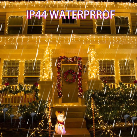 80 Ft Solar Powered Fairy Lights Outdoor Waterproof Silver Wire With 240 LEDs 8 Modes Two Pack Warm White on house in rain