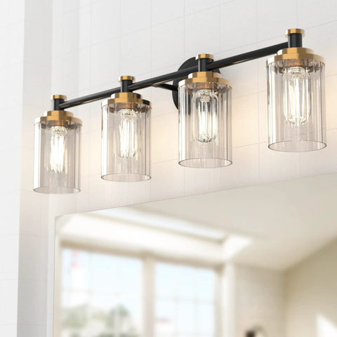Black And Brass Vanity Light Fixture with Cylindrical Clear Stripes Glass Shade and Four Light E26 Socket Base Over Mirror