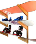 Premium Heavy Duty Solid American Oak Snowboard Wall Rack Holds Three Boards Securely with Extra Stash Zone for Helmets Goggles and Ski Poles for Your Garage or Man Cave Flex Display with snowboards and bindings.
