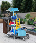 Built Different Heavy Duty Three Shelf Janitorial Cart With Roller Wheels And Secure Protective Cover includes cleaning supplies and caution sign.