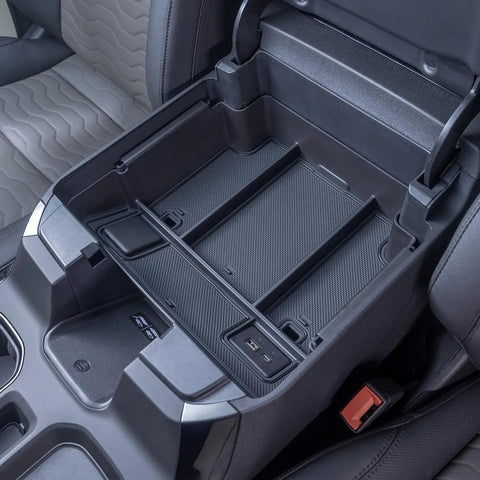 Full Center Console Organizer With Wireless Charging For 2022 2023 2024 2025 2026 Chevy Silverado And GMC Sierra 1500 2500HD 3500HD Crew Cab Fits Bucket Seats Only Keeps Phones Cables And Gear Neat Within Reach showcasing upper tray with USB access in a truck interior.