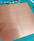 Copper Aluminum Peel And Stick Backsplash Tiles 3x6 Inches Brushed Copper Finish 80 Pack Self Adhesive Kitchen Wall Decor on cutting mat
