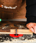 Craftsman using Top Bearing Compression Flush Trim Router Bit with half-inch cutting diameter on wood template for clean trimming