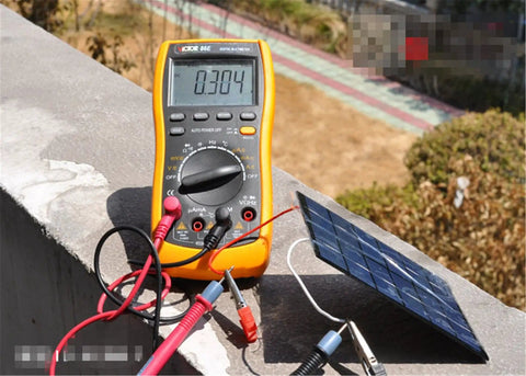 Mini USB Solar Panel Module 2W 6V With Blocking Diode connected to multimeter outdoors