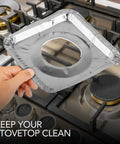Person holding Heavy Duty Aluminum Stove Top Burner Liners 8.5 Inch 100 Pack Disposable Covers over gas range