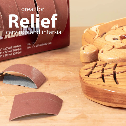 Front view: emery cloth sandpaper rolls in boxed multi-roll dispenser; grits 150–600 for woodturning and metalwork