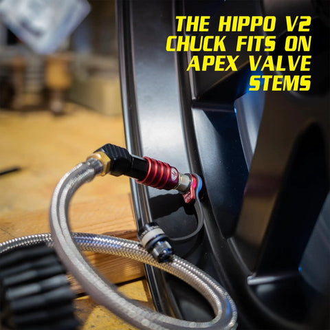 Heavy Duty Tire Inflator Gauge With Backlit Digital Readout 150 PSI Push To Lock Chuck connected to tire valve