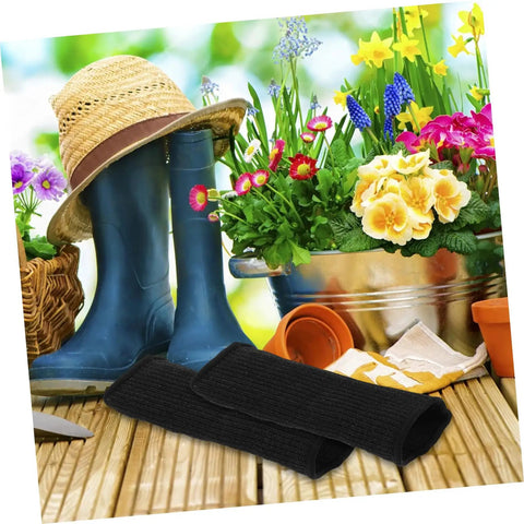 Tough As Nails Protective Arm Sleeves With Serious Cut Resistance For Gardeners Mechanics And Welders on a garden table with flowers.