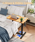 Yihayo Electric Height Adjustable Overbed Table W/ Wheels, 24x16 Inch mobile nursing stand with hidden casters by bed.