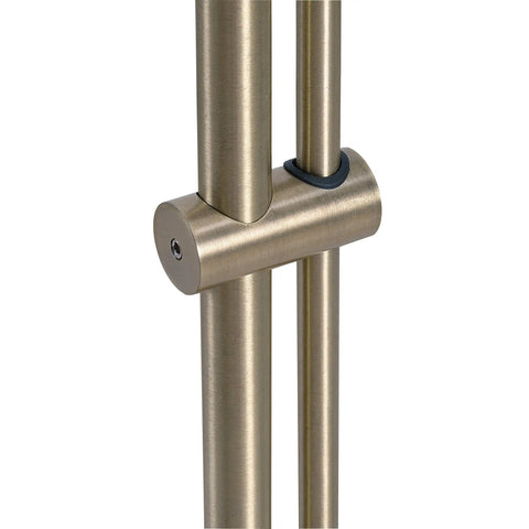 Close-up of antique brass adjustment mechanism on floor lamp with adjustable height and swivel head, classic mid century modern vibe.