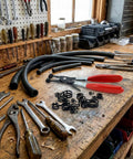 130 Piece Hose Clamp Set With 16 Sizes 6 To 25 mm Swivel Jaw Pliers and tools on wooden workbench in a workshop