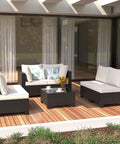 7 Piece Wicker Patio Furniture Set With Waterproof Cushions, Outdoor Conversation Couch Set on a wooden deck