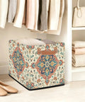 Straight Up 13 Inch Foldable Cube Storage Bin With Heavy Duty Handles For Closet Organization And Nursery Supplies Waterproof Flower Pattern Basket with folded clothes.