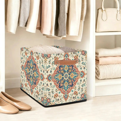 Straight Up 13 Inch Foldable Cube Storage Bin With Heavy Duty Handles For Closet Organization And Nursery Supplies Waterproof Flower Pattern Basket with folded clothes.
