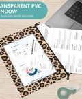 Zippered Leopard Print Coupon And Card Organizer for school supplies with transparent window and binder holes, shown with paper documents