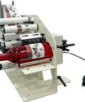 Plug And Play Electric Bottle Label Applicator For 1 To 5 Inch Bottles with red bottle in view, showcasing label application, compact design.