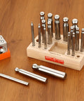 Sturdy Steel Dapping Doming Block Pro Grade 18 Punch Set for jewelry making on wooden stand, showing block and punches for metal shaping.