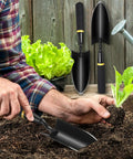 Man using 8 Piece Garden Hand Trowels Set With Pro Grade Heavy Duty Carbon Steel Shovels And Resin Rubberized Handles for planting.