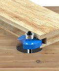 Pack Of 7 Top Notch Carbide Router Bits Set With Ball Bearings for chamfering wood with precision on a workpiece.