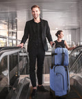 Man with Carry On Luggage For Air Travel 20 Inch Softside Spinner Suitcase With Included Duffel Bag on escalator