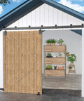 Beefed Up Heavy Duty Exterior Barn Door Hardware Kit For Outdoor Use 12 Foot Box Rail Sliding Track System For One Door 450 Lb Capacity Anti Corrosion Black Finish Ideal For Sheds Stables Garages And Outdoor Barns installed on a wooden barn door