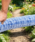 Person installing Soft Infiltration French Drain Pipe 6 Inch Corrugated Drain Tube With Perforated Outer Layer And Inner Reinforcement