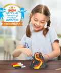 Girl painting reusable volcano mold from Ultimate Volcano Kit For Kids With 3X Eruptions And Pop Crystals That Add Sound