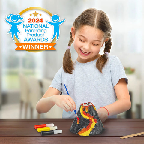 Girl painting reusable volcano mold from Ultimate Volcano Kit For Kids With 3X Eruptions And Pop Crystals That Add Sound