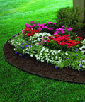 Heavy Duty No Dig Edging Kit For Garden Borders surrounding vibrant flower bed, showing flexible black plastic border edge, 100 foot length