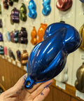 Sample of Texas Metal Blue Pearlescent Basecoat Auto Paint Gallon in hand, showing vibrant blue metallic finish.