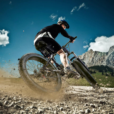 Rider on Beefy Fat Tire 26-Inch Mountain Bike With 21-Speed Drivetrain, 4-Inch Fat Tires, Dual Disc Brakes, Front Suspension Fork.