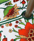Close-up of 60 Inch Round Waterproof Tablecloth With Umbrella Hole And Zipper, floral design, showing spillproof patio cover.