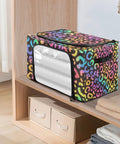 Hella Roomy Foldable Storage Bin With Clear Front Window And Top Front Twin Zippers Built Tough Steel Rod Support Real Sturdy Home Organizer Leopard Print Rainbow Decor on a shelf.