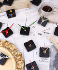 Dope 30Pcs Short Spindle Quartz Clock Movement Kit With Silent Mechanism and hands arranged on table with coffee cup.