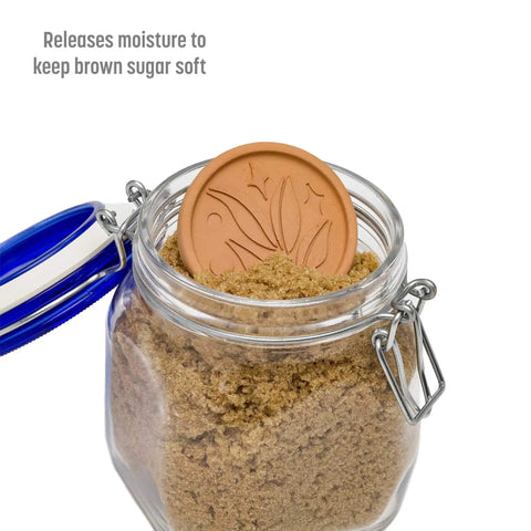 Terracotta Brown Sugar Saver Disc With Elegant Leaf Design And No Fuss Use in a glass jar of brown sugar, lid open