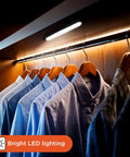 Two Pack LED Light Bars With Motion Sensor, 160 Lumens, Touchless Operation, Magnetic Mount, illuminating clothes in a closet