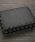 Top Shelf 10 Grid Watch Storage Box With Cushioned Dividers For Organizing Your Cool Watch Collection On The Go Or Desk Display Plus Ring Holder And Travel Essentials Case in black leather, closed view.