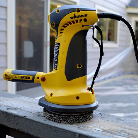 PaintEater Electric Palm Grip Paint Removal Sander Kit For Easy Paint Stripping On Wood And Metal Beast On Paint, Yet Gentle On Surfaces 4-1/2 Inch Orbital Disc Sander 2600 RPM 3M Spun-Fiber Disc Pro-Grade Power DIY Friendly, shown on wood surface.