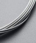 Close-up of Universal Bicycle Shifter Cable Housing Set For Derailleur Systems Durable Black Upgrade Kit to restore smooth gear shifts.